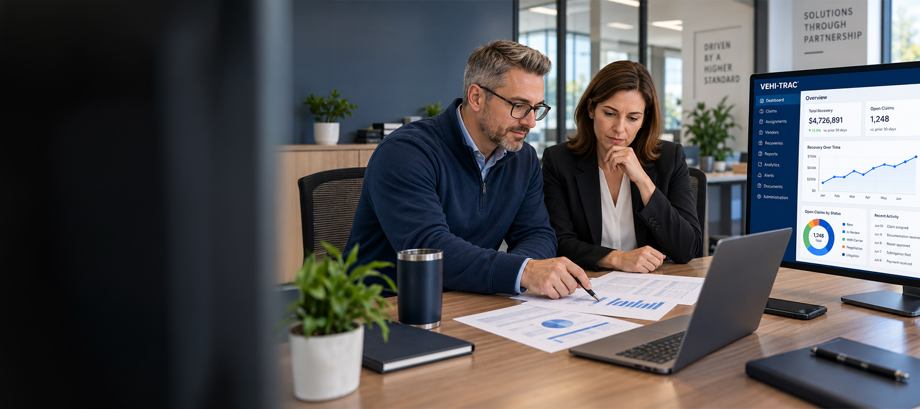 Vehi-Trac software and two people going over results